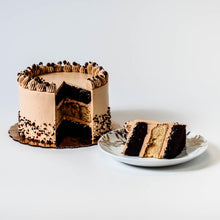Load image into Gallery viewer, Cocoa and Fig Tuxedo Salted Caramel Cake Sliced